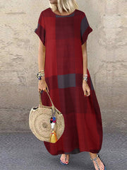 Довга вінтажна жіноча максі-сукня в клітку з круглим вирізом і кишенею