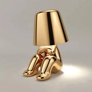 Златна статуа стона лампа са различитим покретима